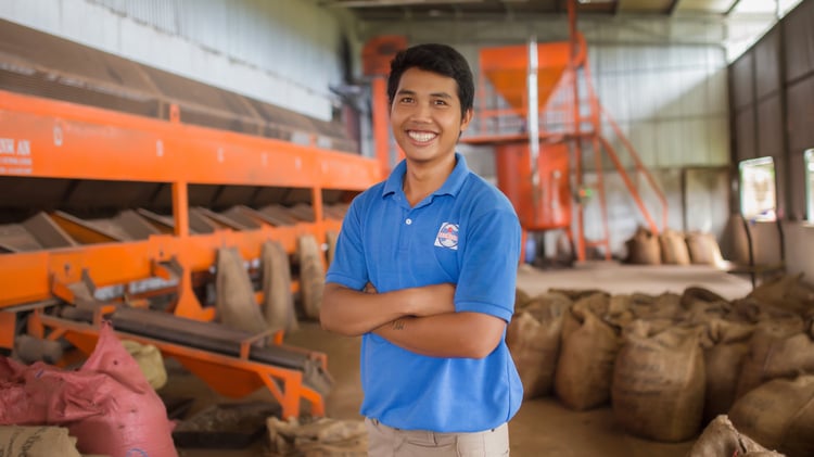 Red River Foods employee at processing center
