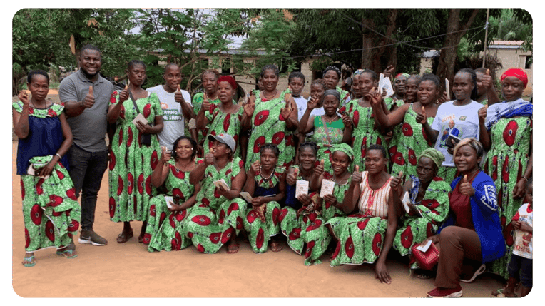 Women and men in VSLA posing for phoot430